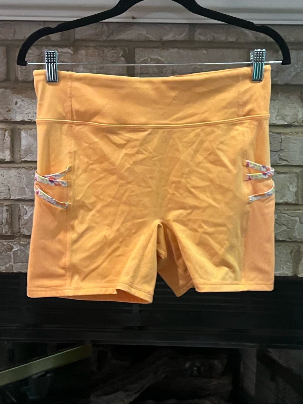 Fabletics Yellow-Orange High-Rise Bike Shorts with Floral Strap Details